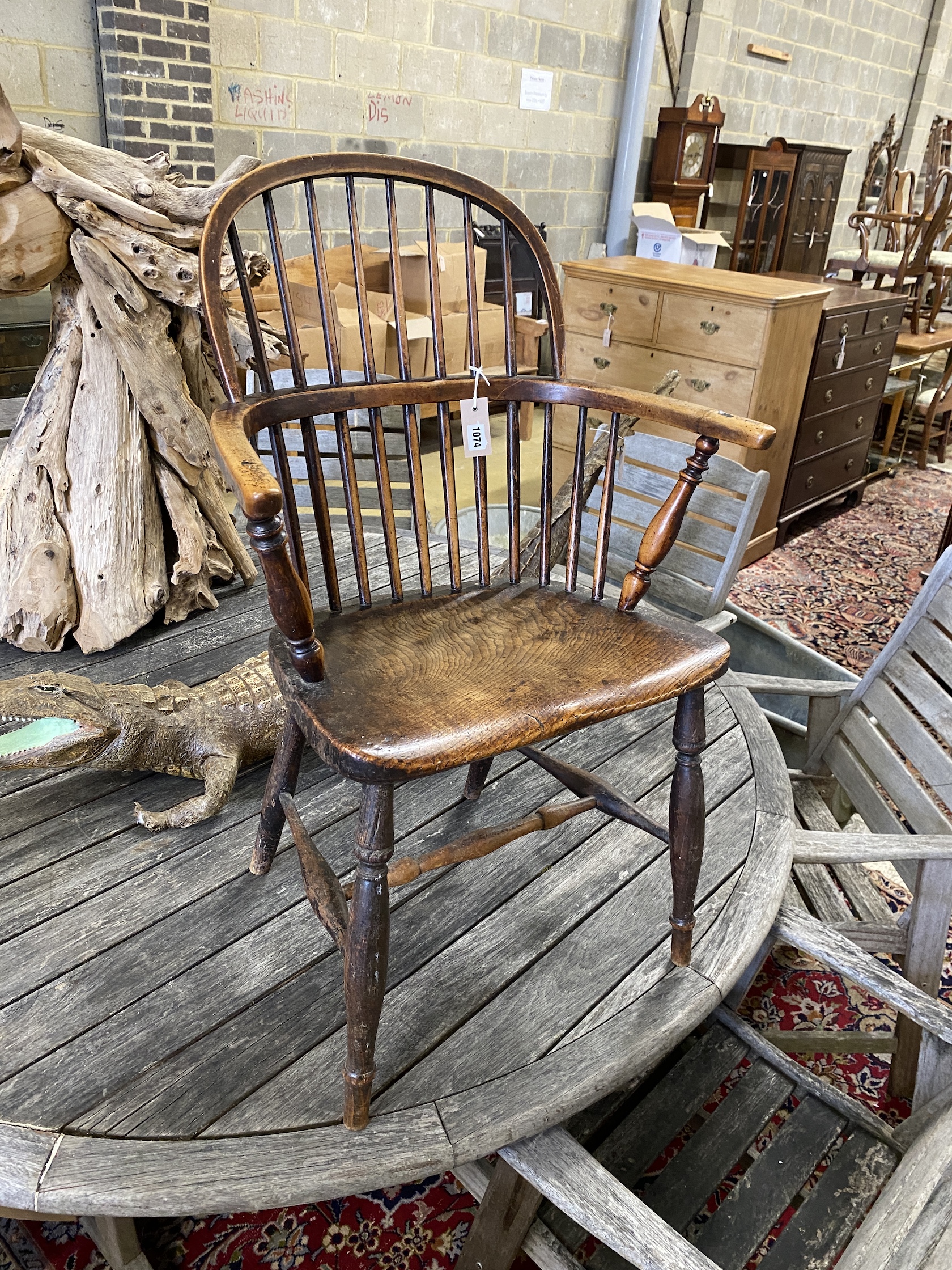 A 19th century Windsor elm and beech comb back elbow chair, width 57cm, depth 36cm, height 90cm